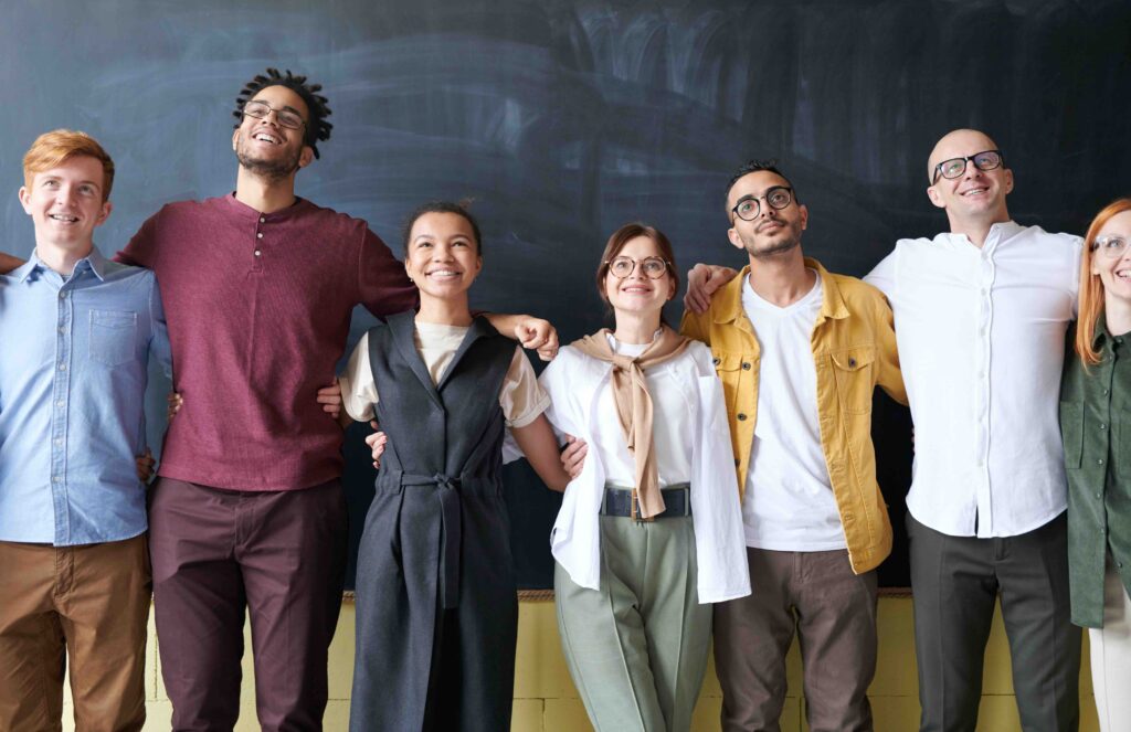 People standing in front of a board